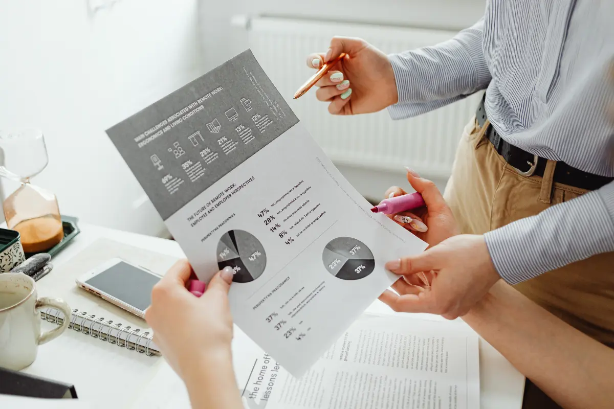 Accounting record review meeting with financial reports and planning documents